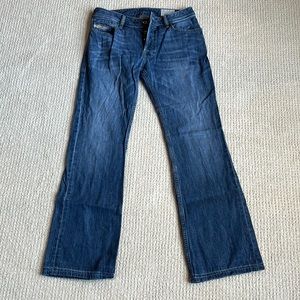 High-quality high-fashioned dark blue diesel Zatiny boot cut jeans.